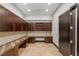 Office space with custom built-in desk and shelving, complemented by a tiled floor at 9501 Balatta Canyon Ct, Las Vegas, NV 89144