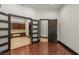 Bright office space with rich hardwood floors and a custom built-in desk and shelving area at 9501 Balatta Canyon Ct, Las Vegas, NV 89144