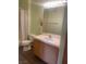Bright bathroom with wood-look flooring, updated vanity, and ample lighting at 1050 E Cactus Ave # 2110, Las Vegas, NV 89183