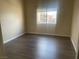 Comfortable bedroom with a large window offering views of the complex at 1050 E Cactus Ave # 2110, Las Vegas, NV 89183