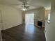 Bright living room with a fireplace and a sliding glass door to the balcony at 1050 E Cactus Ave # 2110, Las Vegas, NV 89183