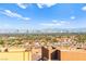 Panoramic view of a city skyline with a community of homes in the foreground at 10525 Shiny Skies Dr, Las Vegas, NV 89129
