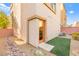 Charming backyard with rock landscaping, a small patch of grass, and privacy fencing at 10525 Shiny Skies Dr, Las Vegas, NV 89129