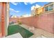 Cozy backyard featuring low-maintenance landscaping, an AC unit, and a serene outdoor living space at 10525 Shiny Skies Dr, Las Vegas, NV 89129