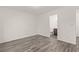 Bright bedroom with wood-look floors and ensuite bathroom access for added convenience at 10525 Shiny Skies Dr, Las Vegas, NV 89129