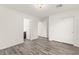 A bright bedroom features wood-look floors and sliding door closet with ample storage space at 10525 Shiny Skies Dr, Las Vegas, NV 89129