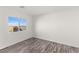 Well-lit bedroom with wood floors and neutral paint that create a relaxing atmosphere at 10525 Shiny Skies Dr, Las Vegas, NV 89129