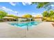 Sparkling community pool with clear blue water and ample deck space, perfect for relaxation and recreation at 10525 Shiny Skies Dr, Las Vegas, NV 89129