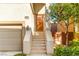 Home's front entrance with a covered porch and stairs leading to the front door at 10525 Shiny Skies Dr, Las Vegas, NV 89129