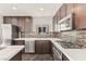 A bright, modern kitchen with stainless steel appliances, quartz countertops and ample storage at 10525 Shiny Skies Dr, Las Vegas, NV 89129