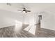 This living room has wood-look floors and an overhead fan at 10525 Shiny Skies Dr, Las Vegas, NV 89129