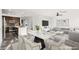 Virtually staged living room with stylish dining area and kitchen, creating an inviting and modern living space at 10525 Shiny Skies Dr, Las Vegas, NV 89129