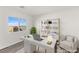 Bright office area with modern desk, chair, and shelving unit with nice view out window at 10525 Shiny Skies Dr, Las Vegas, NV 89129