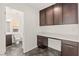 A practical office area with built-in desk and cabinets located next to a full bathroom at 10525 Shiny Skies Dr, Las Vegas, NV 89129