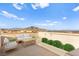 Virtual staging of a cozy roof deck with outdoor furniture and mountain backdrop at 10525 Shiny Skies Dr, Las Vegas, NV 89129