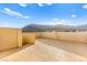 Open roof deck with expansive views of mountains and nearby residences at 10525 Shiny Skies Dr, Las Vegas, NV 89129