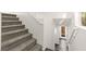 Carpeted staircase leading to the upper level of the house, with white walls at 10525 Shiny Skies Dr, Las Vegas, NV 89129