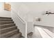 Carpeted staircase leading to an open floor plan with great natural light from nearby windows at 10525 Shiny Skies Dr, Las Vegas, NV 89129