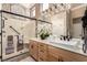 Modern bathroom with walk-in shower, stylish vanity, and sophisticated mosaic tile at 10713 Shoalhaven Dr, Las Vegas, NV 89134