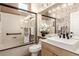 Beautiful bathroom with shower over tub, vanity, and elegant mosaic tile details at 10713 Shoalhaven Dr, Las Vegas, NV 89134