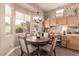 Cozy breakfast nook with a round table, chairs, and natural light at 10713 Shoalhaven Dr, Las Vegas, NV 89134