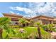Charming home with lush front yard featuring desert plants and a well-maintained lawn at 10713 Shoalhaven Dr, Las Vegas, NV 89134