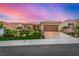 Charming desert home features a tile roof, landscaped front yard, and spacious driveway at 10713 Shoalhaven Dr, Las Vegas, NV 89134
