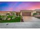 Inviting home with desert landscaping, manicured lawn, and a spacious two-car garage at 10713 Shoalhaven Dr, Las Vegas, NV 89134