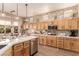Spacious kitchen featuring a breakfast bar, stainless steel appliances, and ample counter space at 10713 Shoalhaven Dr, Las Vegas, NV 89134