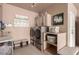 Organized laundry room equipped with modern washer, dryer, and storage solutions at 10713 Shoalhaven Dr, Las Vegas, NV 89134