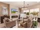 Cozy living room with a fireplace, comfortable seating, and a mounted TV at 10713 Shoalhaven Dr, Las Vegas, NV 89134