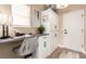 Comfortable home office with a built-in desk, storage cabinets, and natural light at 10713 Shoalhaven Dr, Las Vegas, NV 89134