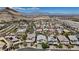 A vibrant community nestled amidst rolling hills and a landscape dotted with modern homes at 10954 Free Flow Pl, Las Vegas, NV 89138
