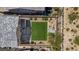 Aerial view of backyard with lawn, stone border, patio, and landscaping design at 10954 Free Flow Pl, Las Vegas, NV 89138