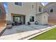 Inviting backyard patio with outdoor kitchen, fire pit, seating area, and low-maintenance landscaping at 10954 Free Flow Pl, Las Vegas, NV 89138