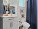 Stylish half-bathroom with contemporary vanity, a toilet with a bidet, and elegant accents at 10954 Free Flow Pl, Las Vegas, NV 89138
