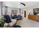 Inviting primary bedroom with large bed, comfortable seating, and lots of natural light at 10954 Free Flow Pl, Las Vegas, NV 89138