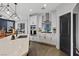 Modern kitchen showcasing stainless steel appliances, white cabinetry, and stylish pendant lighting at 10954 Free Flow Pl, Las Vegas, NV 89138