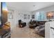 Living room featuring modern decor, comfortable seating, and a large television at 10954 Free Flow Pl, Las Vegas, NV 89138
