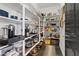 Walk-in pantry with ample shelving and storage for food and kitchen appliances at 10954 Free Flow Pl, Las Vegas, NV 89138