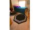 Comfortable bedroom with a bed, decorative pillows, and two unique octagonal carpets on neutral carpet flooring at 11021 Pentland Downs St, Las Vegas, NV 89141