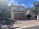 Charming two-story home with a brick driveway and a neutral color scheme, offering curb appeal at 11021 Pentland Downs St, Las Vegas, NV 89141