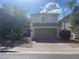 Charming two-story home with a brick driveway and a neutral color scheme, offering curb appeal at 11021 Pentland Downs St, Las Vegas, NV 89141