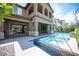 Backyard view featuring a swimming pool and covered patio at 12018 Vento Forte Ave, Las Vegas, NV 89138