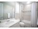 Clean, modern bathroom featuring a shower over tub, sink, and neutral color palette at 12018 Vento Forte Ave, Las Vegas, NV 89138