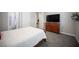 This bedroom features a large dresser with a mounted television at 12018 Vento Forte Ave, Las Vegas, NV 89138