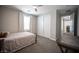 This bedroom features a ceiling fan, window shutters, and a large closet at 12018 Vento Forte Ave, Las Vegas, NV 89138