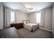 This bedroom features window shutters, a ceiling fan, and a large dresser at 12018 Vento Forte Ave, Las Vegas, NV 89138