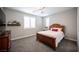 Cozy bedroom with a big window for natural light and comfortable furniture at 12018 Vento Forte Ave, Las Vegas, NV 89138