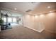 Large bonus room with stairs, leading to workout area and covered patio access at 12018 Vento Forte Ave, Las Vegas, NV 89138